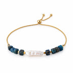 Pulsera AILA · Perla Barroca y Ojo de Tigre Azul