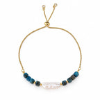 Pulsera AILA · Perla Barroca y Ojo de Tigre Azul