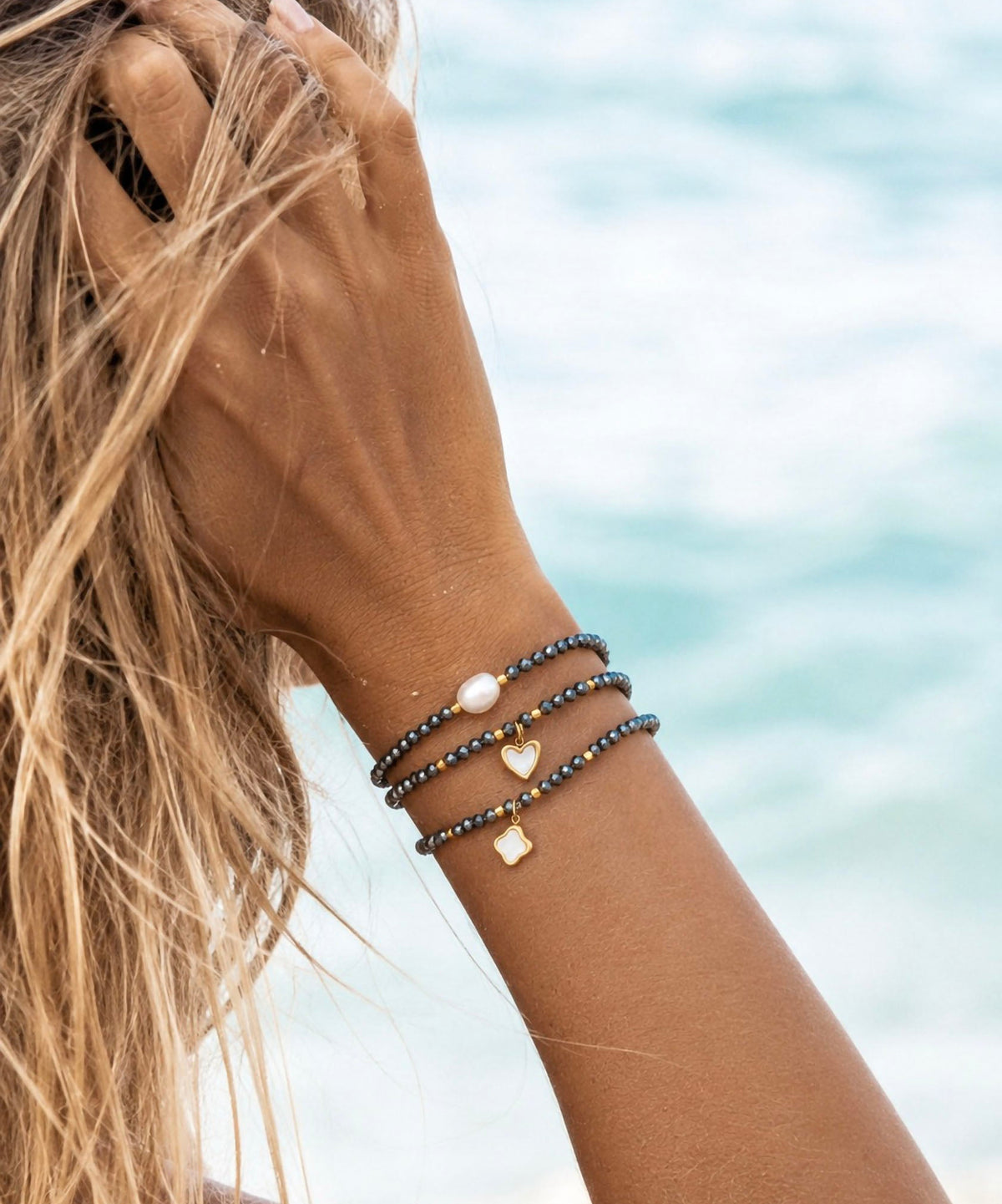 AN-PU-Set of 3 Hematite bracelets on models hand